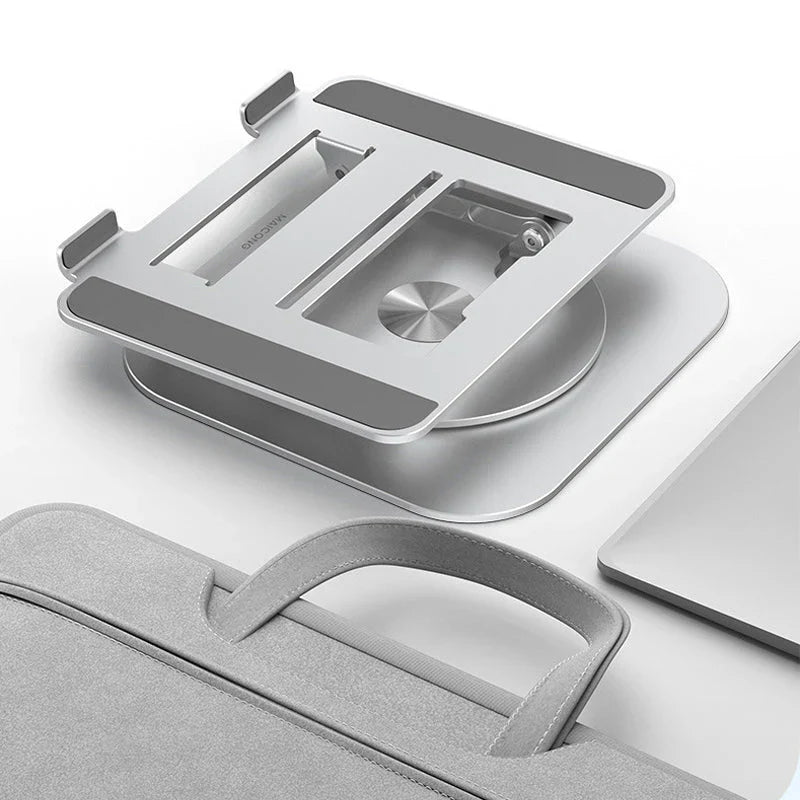 Belro swivel laptop mount attached to a desk, adjustable and ergonomic for computers in a modern workspace.