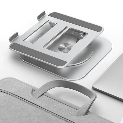 Belro swivel laptop mount attached to a desk, adjustable and ergonomic for computers in a modern workspace.