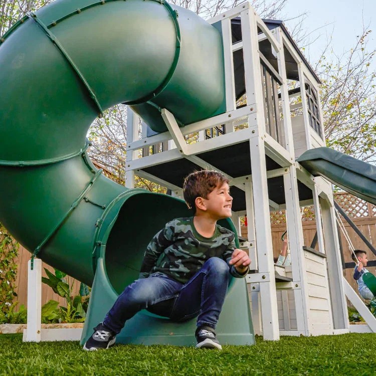 Casavibeo Kidkraft Wrangler Way Swing Set with slides, swings, and climbing features in a colorful outdoor play structure.