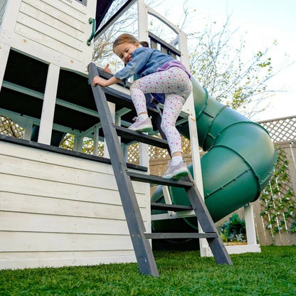 Casavibeo Kidkraft Wrangler Way Swing Set with slides, swings, and climbing features for kids in a backyard play area.