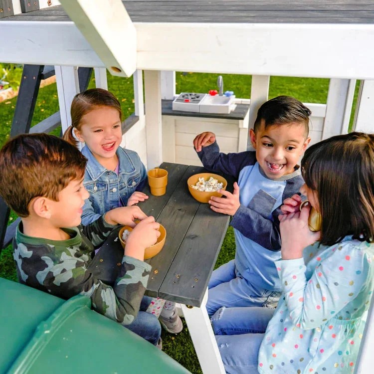 Casavibeo Kidkraft Wrangler Way Swing Set with slides, swings, and climbing features for kids' outdoor play.
