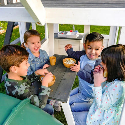 Casavibeo Kidkraft Wrangler Way Swing Set with slides, swings, and climbing features for kids' outdoor play.