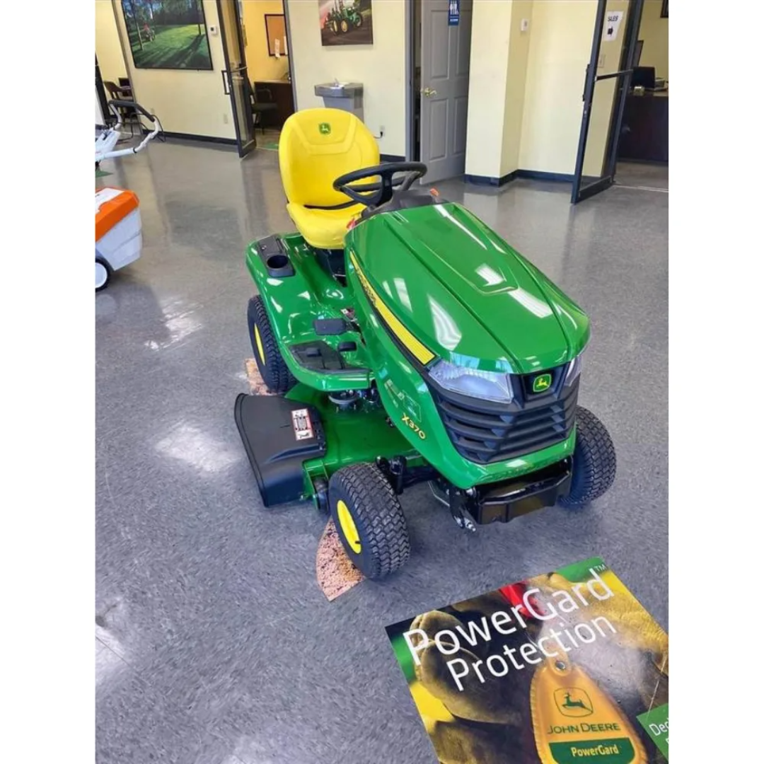 Casavibeo John Deere X370 lawn tractor with 42-inch cutting deck, featuring a sturdy build and large mower blades for efficient yard work.
