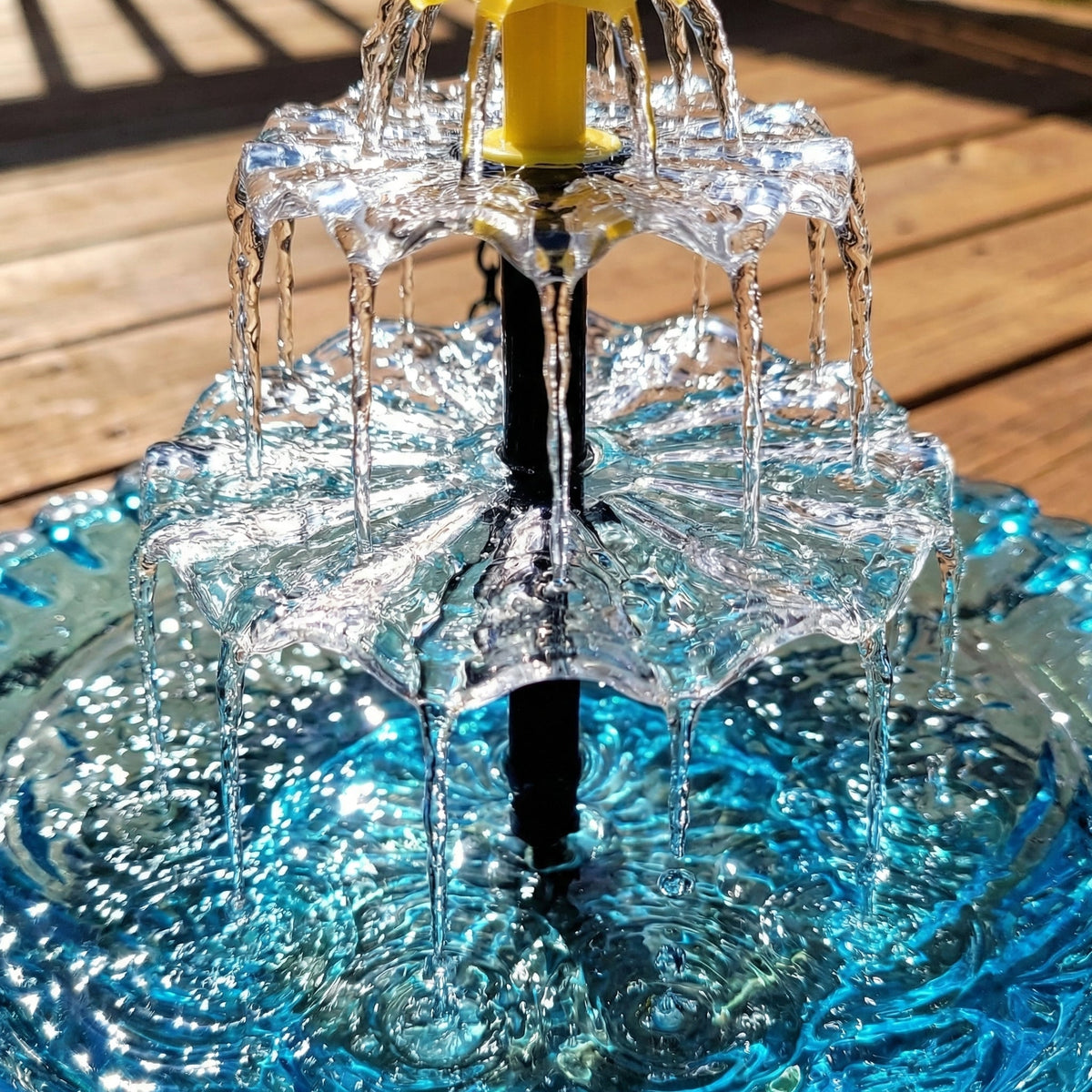 Mivoza solar bird bath fountain with two-tier garden water feature, no power needed, surrounded by greenery in a garden setting.