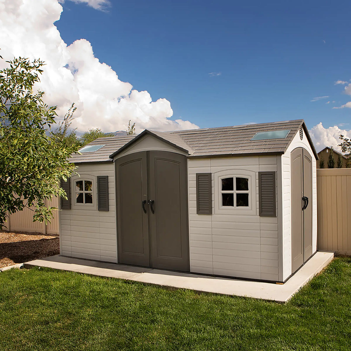 Casavibeo Lifetime 60079 outdoor storage shed with dual-entry doors, 15 ft. by 8 ft., in desert sand color, sturdy metal construction.