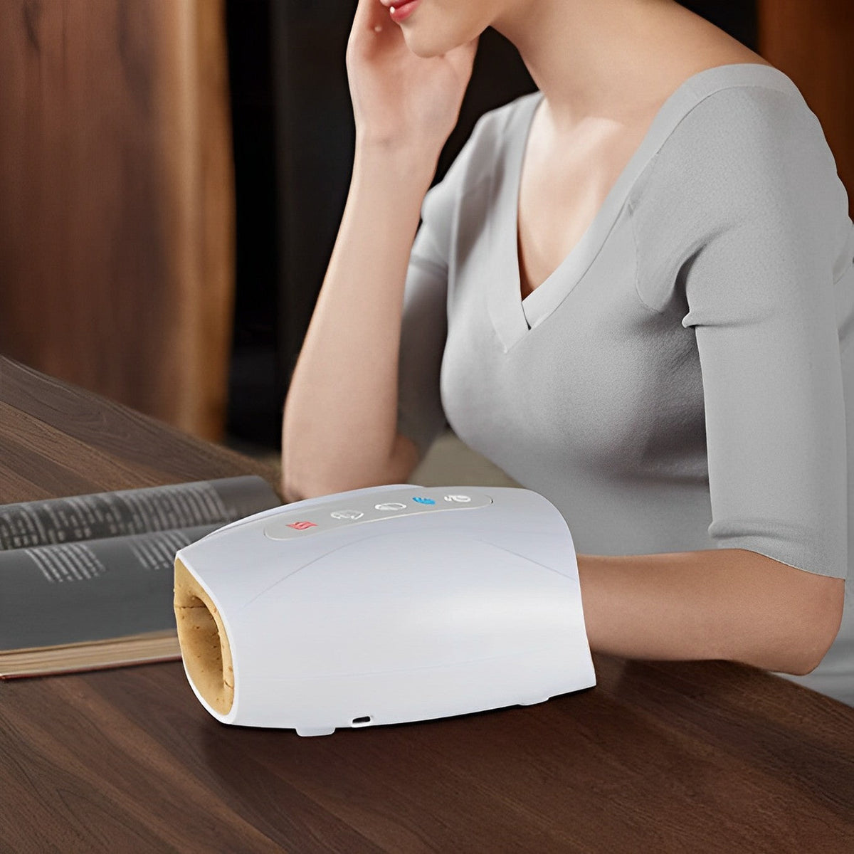 Belro electric hand massager with heat feature, showing the device with textured grips and control buttons for personal relaxation.
