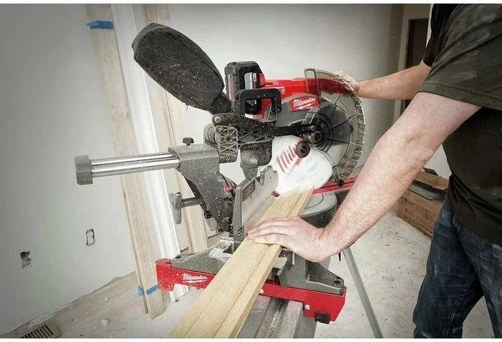 Milwaukee 18V Lithium-Ion brushless cordless 12-inch dual bevel sliding compound saw with blade and adjustable handle.