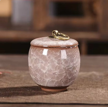 Handcrafted ceramic pet urn for dogs and cats, featuring intricate designs, used as a memorial keepsake for beloved pets.