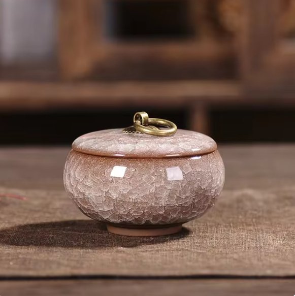 Handcrafted ceramic pet urn by BowLift, featuring a detailed design, for memorial keepsake of dogs and cats.