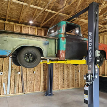 BendPak 10AP-168 two-post car lift by Casavibeo, 10,000-lb capacity, 168-inch height, with vehicle positioned for lifting.