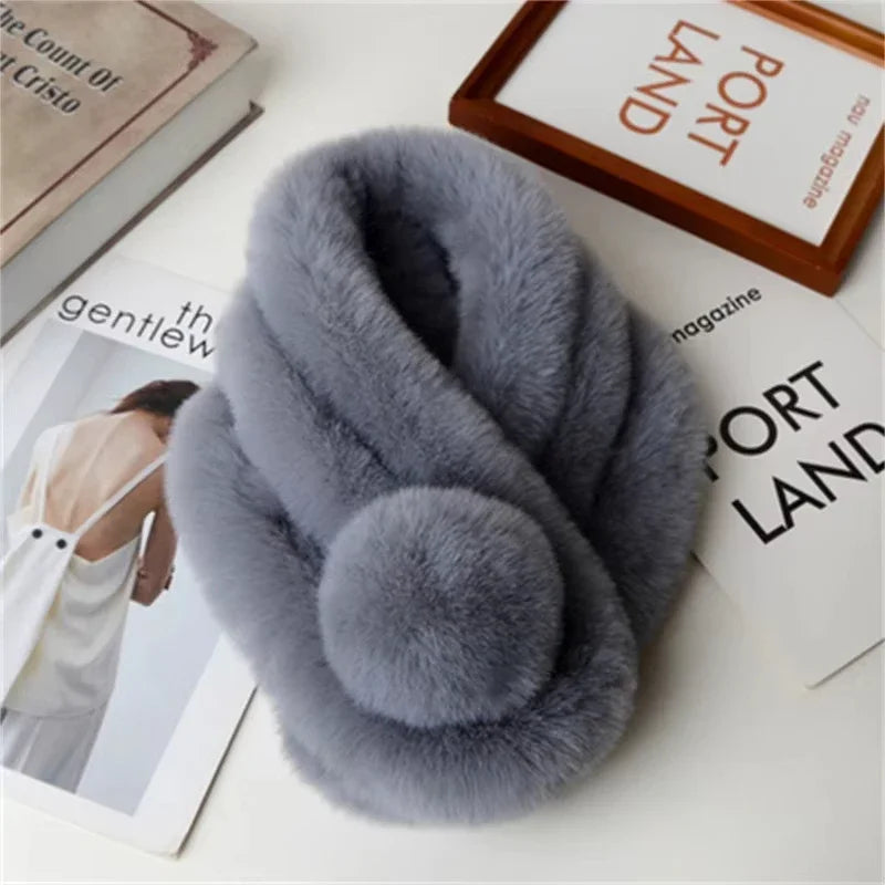 Gray plush faux fur winter scarf by Belro, soft and cozy clothing accessory with a luxurious texture.