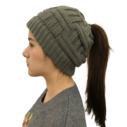 Gray women's Belro knit beanie with a stylish ponytail opening, perfect for winter accessories and cold weather warmth.