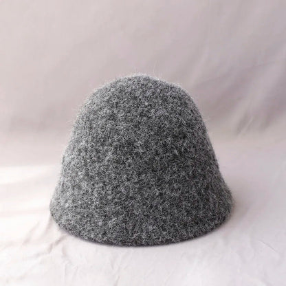 Gray women's winter wool bucket hat by Belro, cozy and stylish accessory for cold weather, with a soft knit texture.
