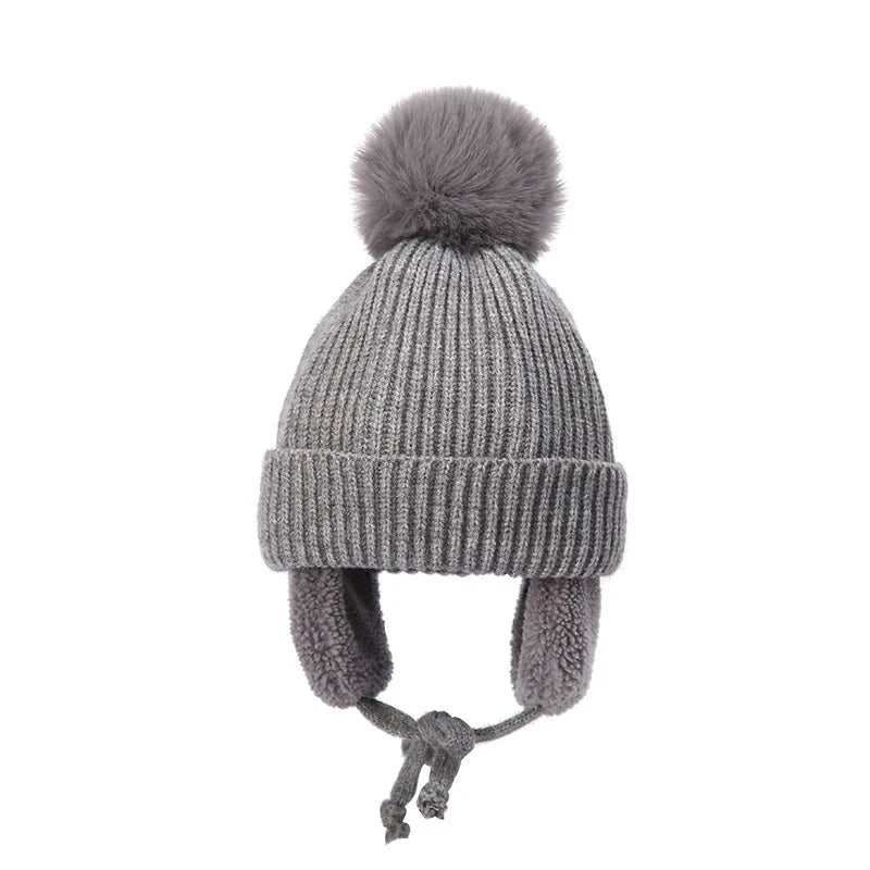 Gray kids knit beanie winter hat with earflaps, Belro brand, cozy and warm accessory for cold-weather outdoor wear.