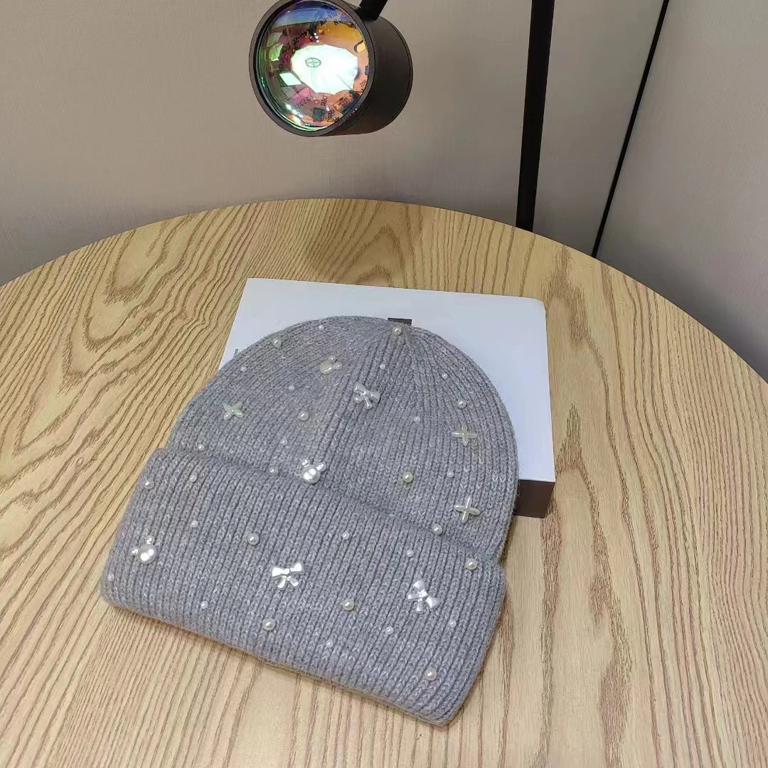 Gray Pearl Accent Knit Beanie winter hat by Belro with pearl embellishments, cozy knit fabric, and a snug fit for cold weather.