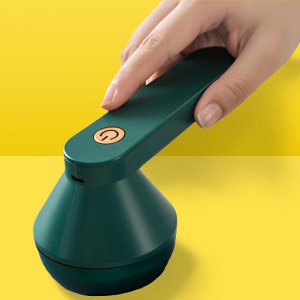 Green Belro rechargeable anti-pilling razor for home and garden, designed to remove lint and pills from fabric and furniture.