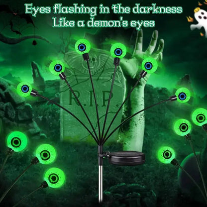 Green solar-powered Halloween eyeball garden light accessory with illuminated eyeball design, perfect for spooky outdoor decor.