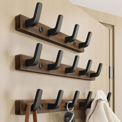 Minimalist wall-mounted coat hook by Belro with wood and metal design for hanging jackets and coats.