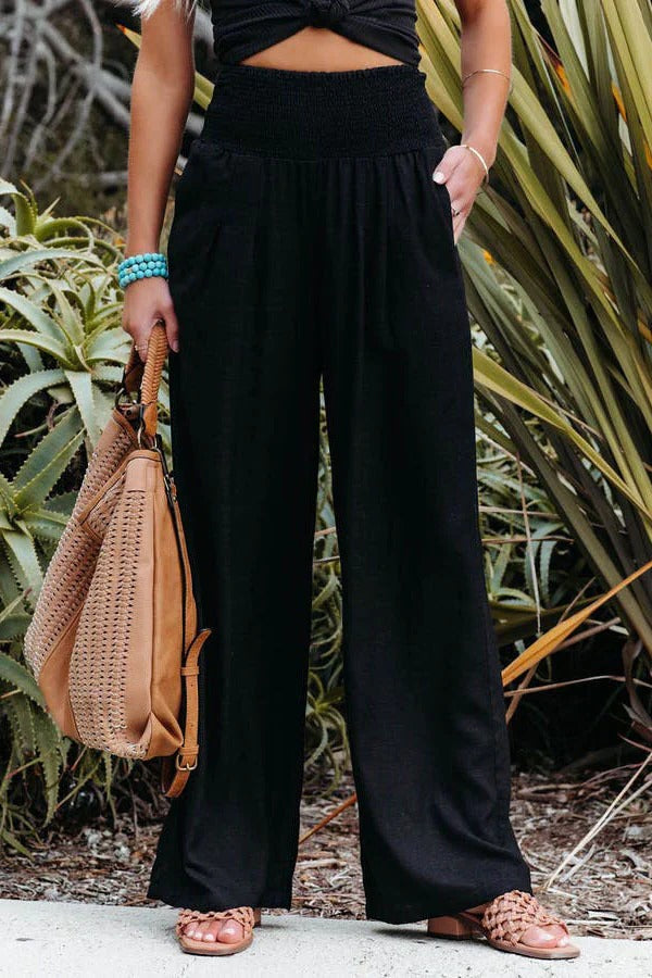Belro cotton and linen pants showing lightweight, breathable fabric with a relaxed fit in neutral colors.