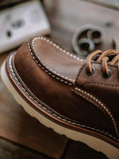 Men's full grain leather moccasin toe work boots by Belro, featuring sturdy construction and classic boot design.