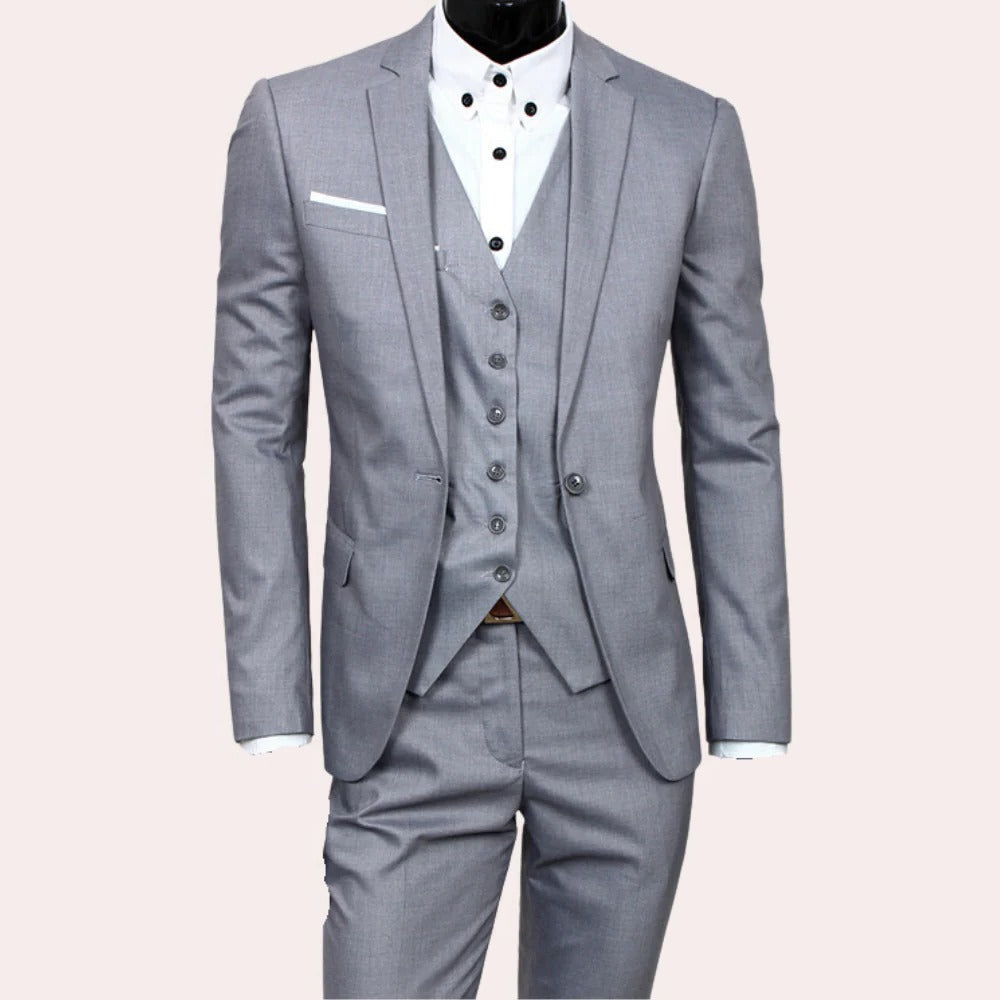 Belro 3-piece men's suit displayed on a hanger, featuring a jacket, vest, and trousers in classic dark fabric.
