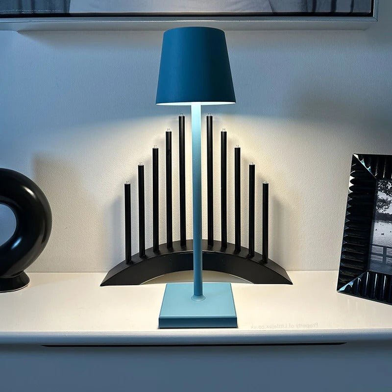 Belro contemporary cordless modern table lamp with sleek design and illuminated soft white light on a desk.