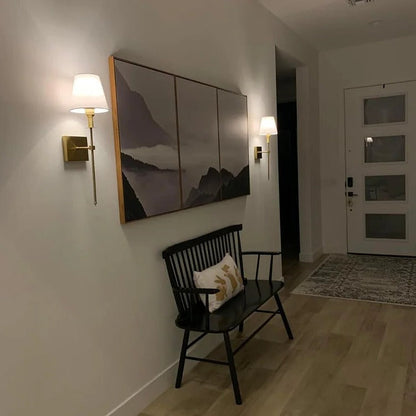 Belro rechargeable wireless wall light set with two battery-powered indoor and outdoor lights mounted on a home exterior wall.