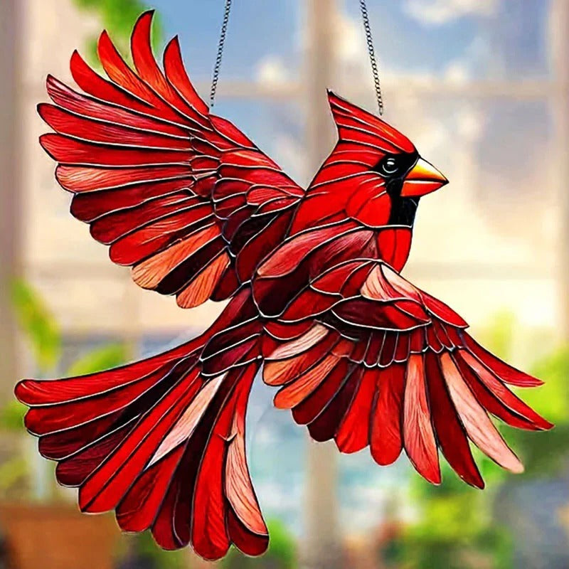 Colorful Belro hummingbird suncatcher hanging in a garden, reflecting sunlight with vibrant glass wings and intricate details.
