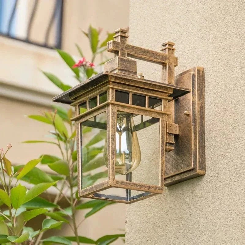 Belro outdoor wall light mounted on a garden wall, weather-resistant fixture with a modern design for outdoor lighting.