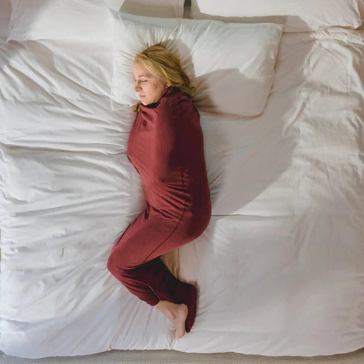 Belro adult swaddle blanket, soft and cozy, shown draped on a bed for comfortable home bedding or throw use.