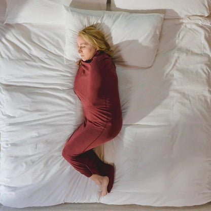 Belro adult swaddle blanket, soft and cozy, shown draped on a bed for comfortable home bedding or throw use.
