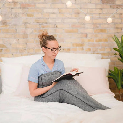 Belro adult swaddle blanket, soft and cozy, perfect for home bedding or lounging, shown in a relaxed draped position.