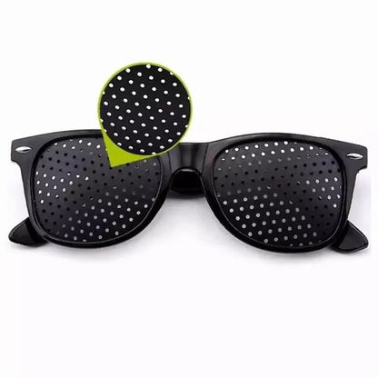 Belro corrective pinhole glasses with clear lenses designed to improve focus, shown in a close-up image.