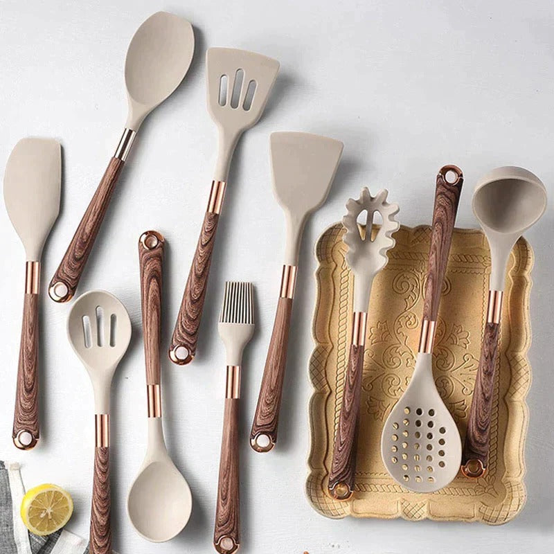 Belro kitchen utensil set with wooden handles including spatulas, spoons, and tongs, arranged on a countertop.