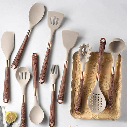 Belro kitchen utensil set with wooden handles including spatulas, spoons, and tongs, arranged on a countertop.
