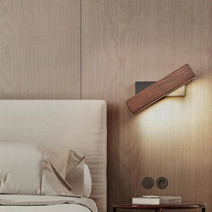 Belro wall-mounted LED outdoor lamp attached to garden wall, illuminating the space with modern lighting.