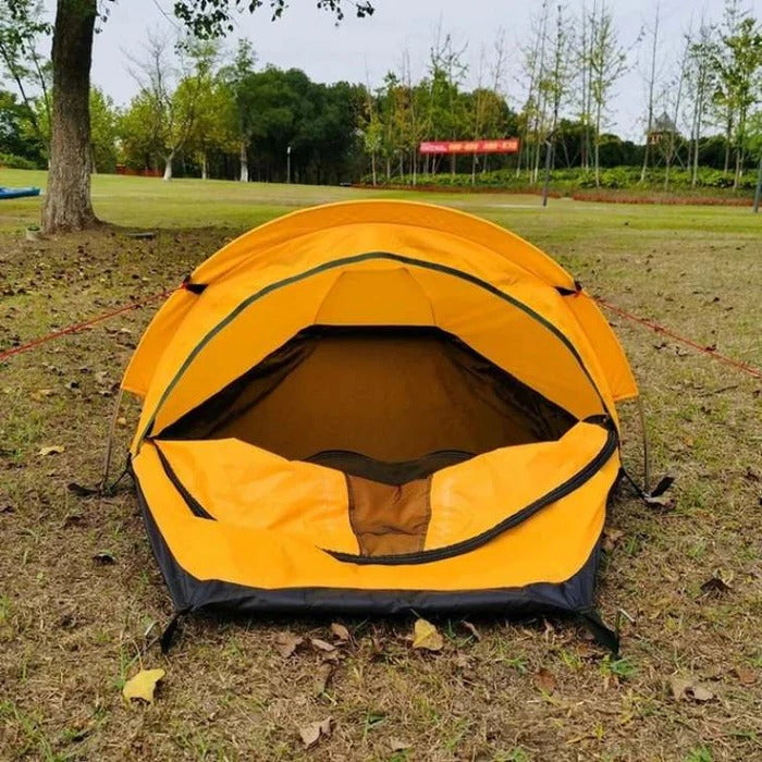 Belro ultralight single-person tent set up outdoors, showcasing compact design and lightweight construction for solo camping adventures.