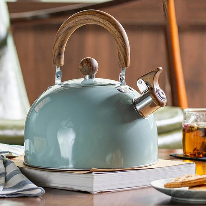 Belro whistling kettle for hot drinks, featuring a classic metal design and a handle for easy pouring in a kitchen setting.