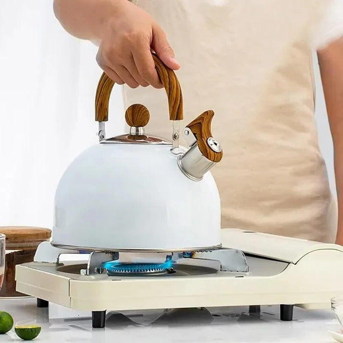 Belro whistling kettle for hot drinks, featuring a stainless steel design with a black handle and spout, suitable for kitchen use.