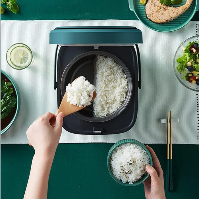 Belro mini rice cooker on kitchen countertop, compact home appliance for easy rice cooking and meal preparation.