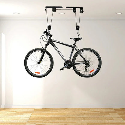 Ceiling-mounted bike hoist by Belro, showing the device attached to the ceiling and lifting a bicycle for space-saving storage.