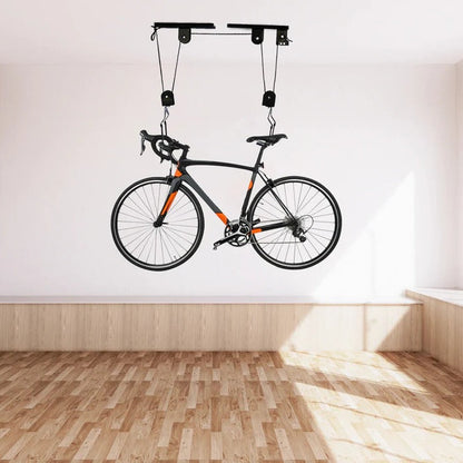 Ceiling mounted bike hoist by Belro, suitable for home storage, showing the hoist lifting a bicycle in a garage setting.