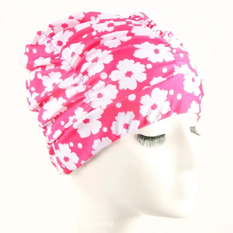 Belro stylish stretch swimming cap in bright blue, designed for comfortable fit and outdoor swimming activities.