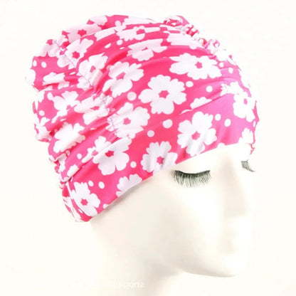 Belro stylish stretch swimming cap in bright blue, designed for comfortable fit and outdoor swimming activities.