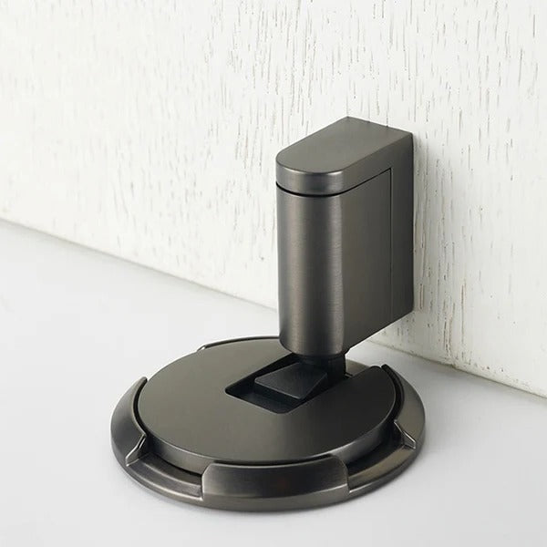 Belro heavy-duty adjustable door stopper in black, shown mounted on a door to prevent movement and protect walls.