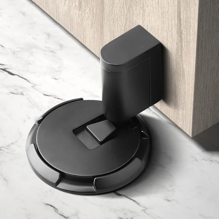Heavy duty adjustable door stopper by Belro, made of durable metal, mounted on a door to prevent movement and damage.