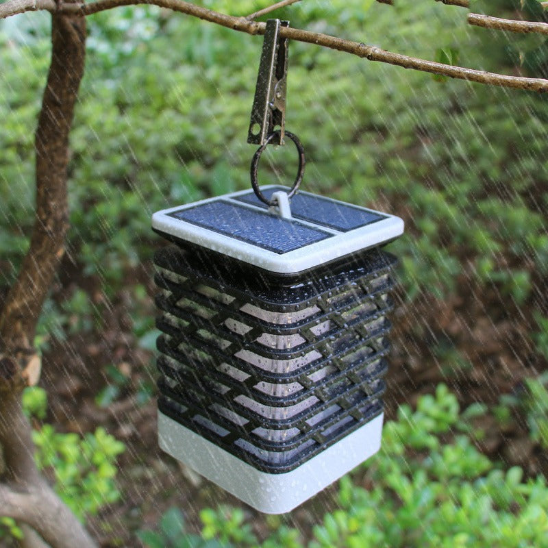 Belro Solar LED garden lantern illuminating a patio with warm light, ideal for outdoor home and garden decor.