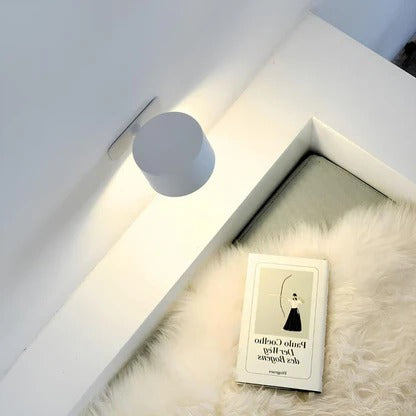 Belro rechargeable wall light with 360° rotation, mounted on wall, showcasing adjustable LED lighting for versatile illumination.