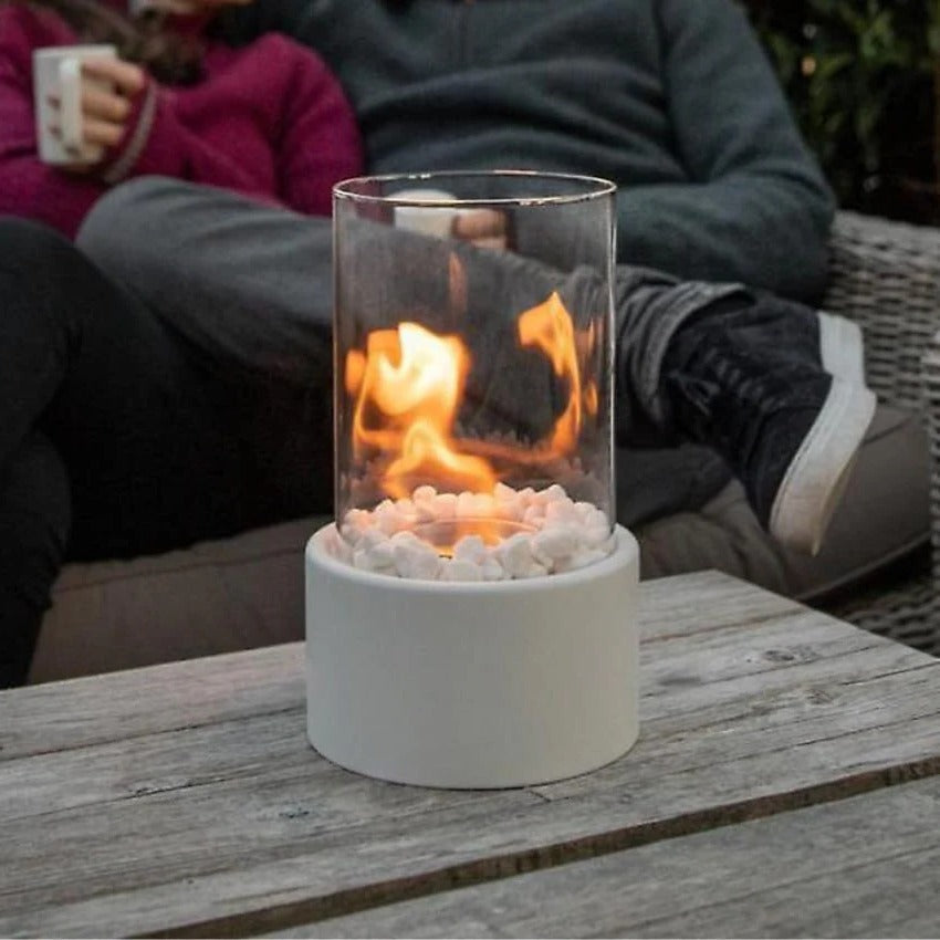 Belro portable glass tabletop fireplace for outdoor use, featuring sleek glass design and compact size for home and garden ambiance.