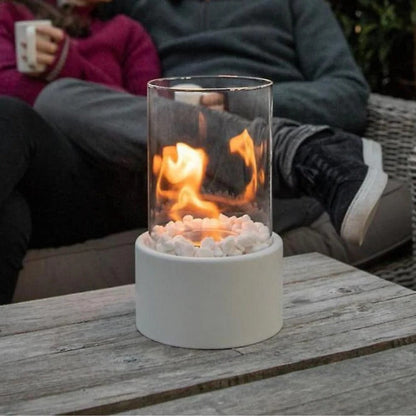 Belro portable glass tabletop fireplace for outdoor use, featuring sleek glass design and compact size for home and garden ambiance.
